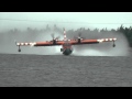 CL-415 Canadair or Bombardier Water Bomber pick up and water drop