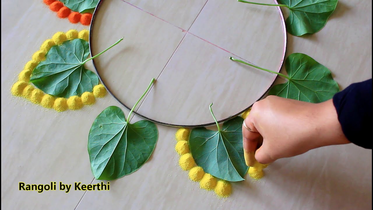 beautiful diwali rangoli design with leaves by keerthi