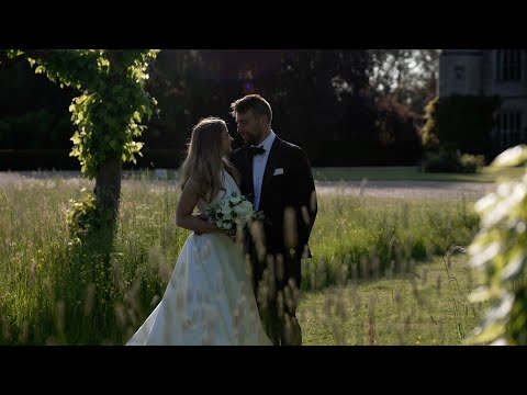 A Summer Wedding party in the courtyard at Hengrave hall in Suffolk