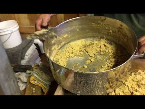 Sugarmaker demonstrates how to make granulated maple sugar