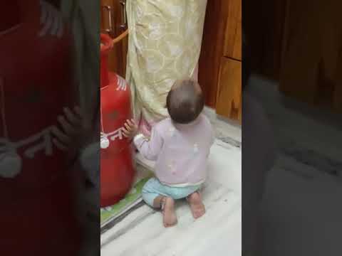 Kavisha playing in kitchen