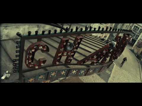 End-of-show glow: curtain call in warm light, orchestra packing up