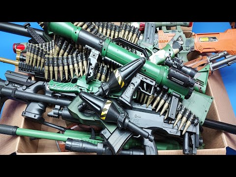 Box of military guns toys & Airsoft / AK-47,1911,cal45,Rocket Launcher...