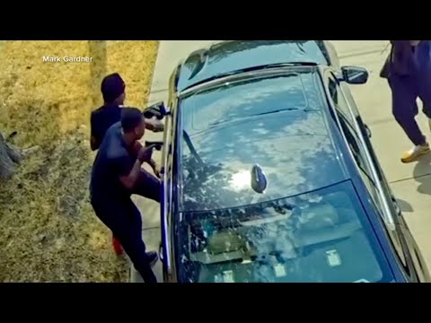 Frightening 'jugging' robbery caught on camera