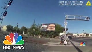 Dramatic Video Captures Officer Saving Man Trapped On Train Tracks | NBC Nightly News