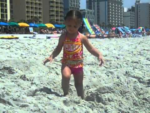 Lily playing on the beach