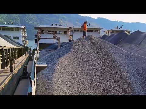 Barge unloads concrete gravel - smooth flow -Video completed