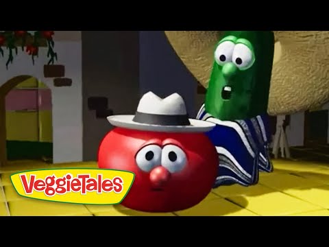 Red tomato character with a gray hat and surprised eyes sits on a yellow floor while a green cucumber in a striped robe looms behind in a VeggieTales scene, logo in the corner.