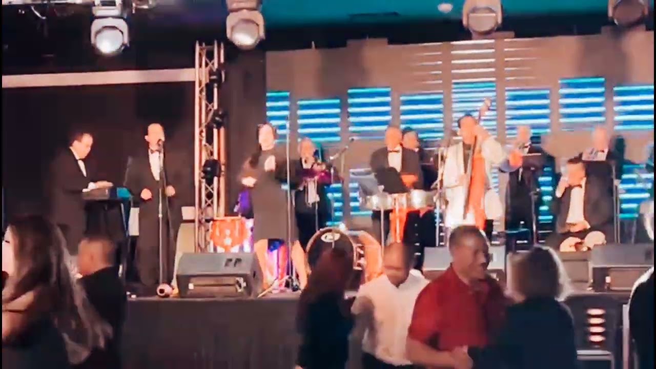 Bridgette Maria dances on stage with Carlos Rivas y Mexsal