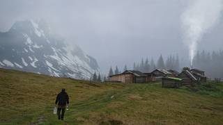 Abandoned shelter in the mountains, a night in a rustic log cabin with a stove