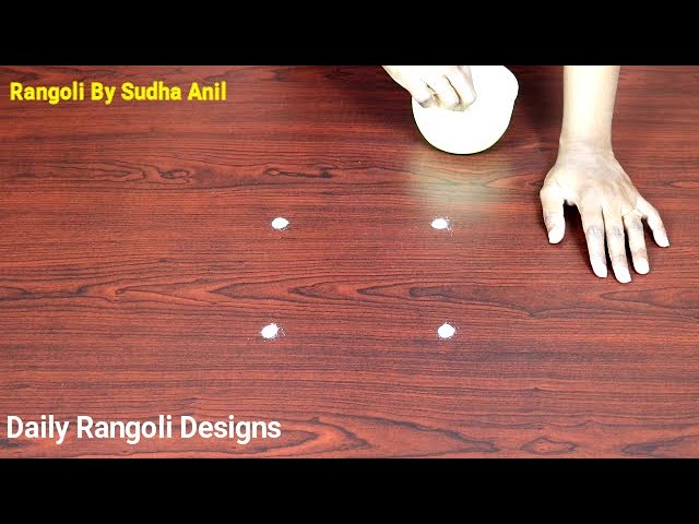 Simple rangoli design with 2 dots by sudha anil