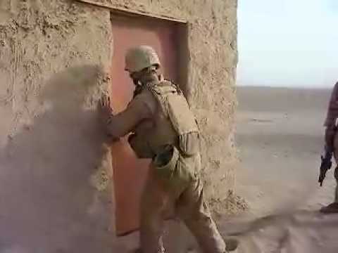 Marine Kicking Down Door