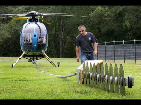 Helicopter Tree Cutting Saw Power helicopter tree trimming Sawing near Power Line