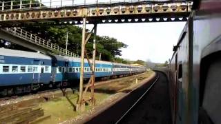 preview picture of video 'IRFCA - TVC Rajdhani Express Overtakes the Ernakulam Okha Biweekly behind'