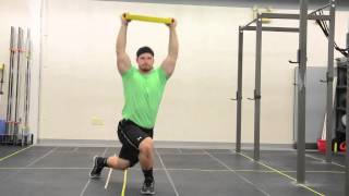 83. Overhead Plate Cross Behind Lunge