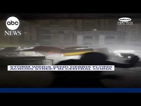 Powerful winds send debris flying down street in China