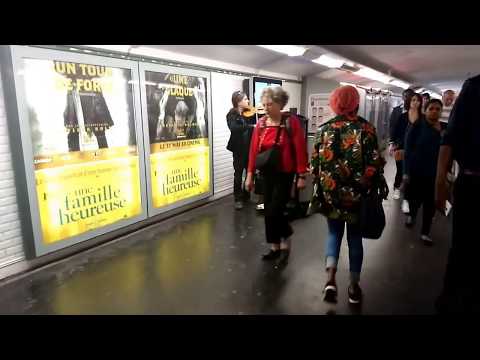 Guy plays violin at Paris metro station
