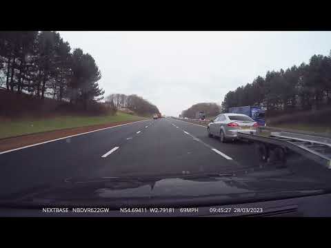 Mondeo towing large trailer on M6 at 70+ mph in outside lane