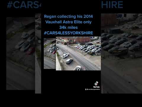 Regan collecting his 2014 Vauxhall Astra Elite from Cars 4 Less Yorkshire