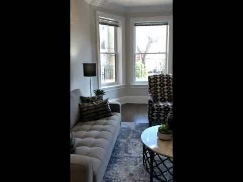 1755 Beacon Street - luxury Brookline duplex condo for sale. Main living level and private deck.