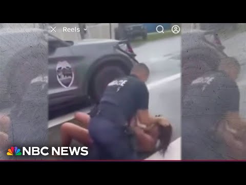 Altercation between parent and police officer over school parking caught on camera