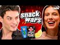 Millie Bobby Brown Louis Partridge Go Head To Head In The Ultimate Snack Wars Showdown