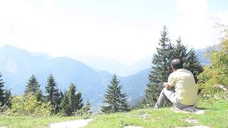 Sitting Alone at Mountain Side - royalty free stock video footage
