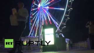 preview picture of video 'USA: $15 million Ferris wheel lights up National Harbour'