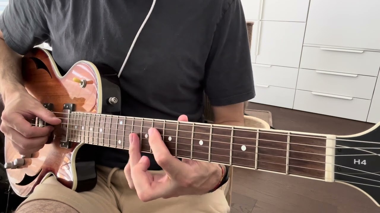 Guitarist comping the jazz standard Autumn Leaves with chords rooted on the D string