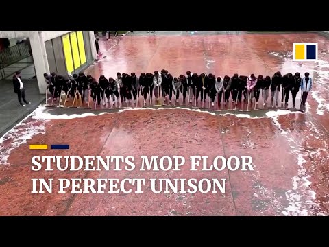 Students stand in line to mop floor in perfect unison in China
