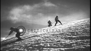 Men sliding downhill and demonstrating the advanced stem turn technique in the Un...HD Stock Footage