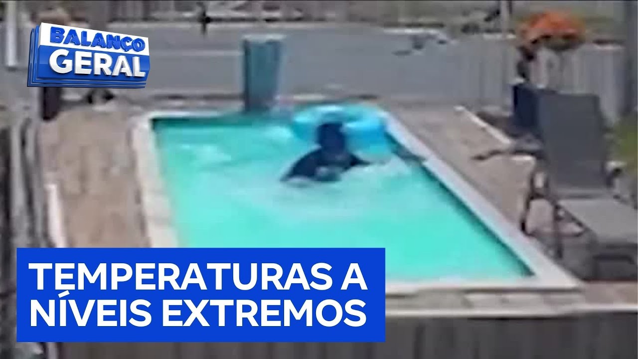 ES: motociclista estaciona veículo e mergulha com capacete em piscina de loja para aliviar calor