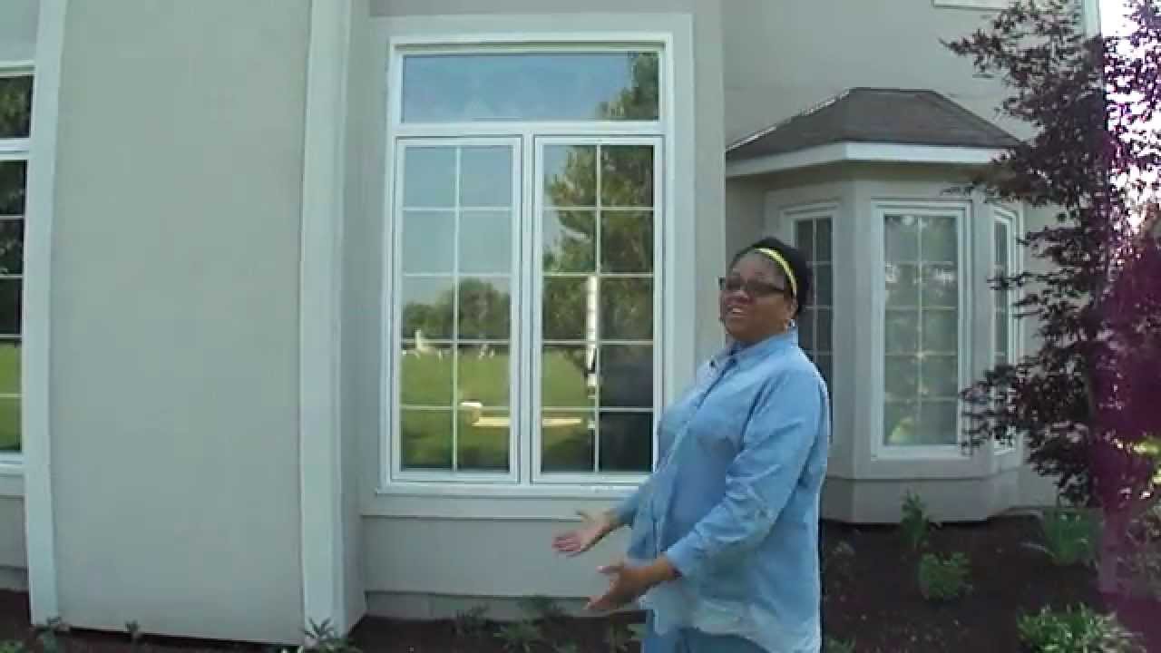 Homeowner Shows Her New Windows Installed by Opal Enterprises in Naperville