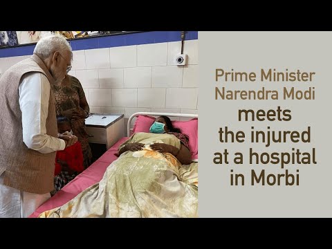 Prime Minister Narendra Modi meets the injured at a hospital in Morbi l PMO
