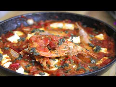 Shrimp in a tomatoes and feta sauce with wine or ouzo - Shrimp saganaki a perfect summer appetizer
