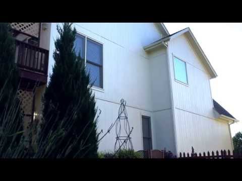 Washing windows with Windex Outdoor