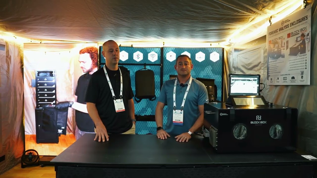 Law enforcement officers discussing Mission Darkness equipment