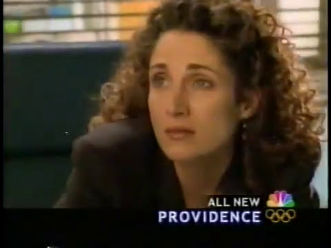 Providence NBC drama promo still with Melina Kanakaredes as Dr. Sydney Hansen walking through Providence