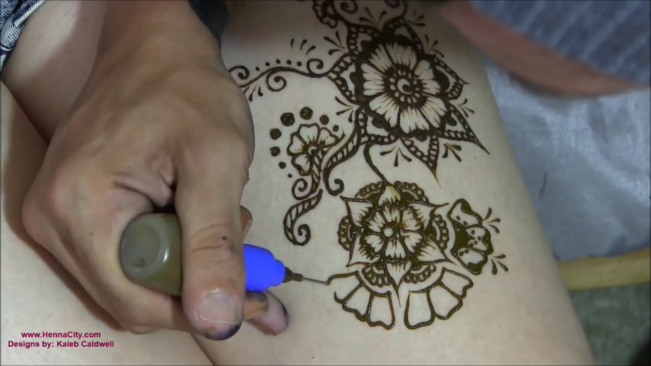simple arabic mehndi tattoo design on legs by henna city
