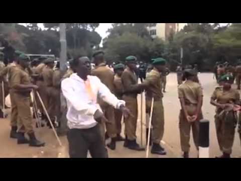 a drunk kenyan shouts at the police in his native language
