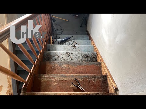 Removing old carpet from a wooden staircase