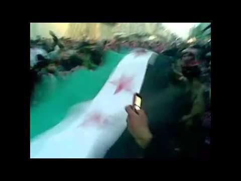 رفع علم الاستقلال أثناء مظاهرة في حي المرجة في مدينة حلب في جمعة "إن تنصروا الله ينصروكم"