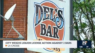 City weighs liquor license action against two bars