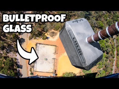 Aerial view of a rooftop with a bold 'BULLETPROOF GLASS' title and a white arrow pointing to the roof.