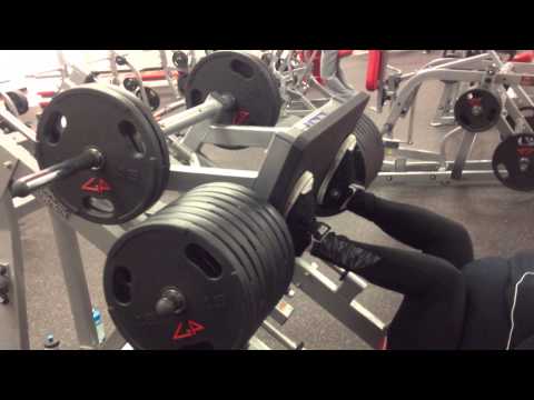 Female doing a big leg press 20 plates