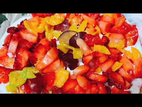 Layering of homemade pink vanilla cake with roasted pistachio and fresh fruit