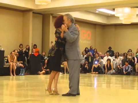  Enriqueta Kleinman  and  Osvaldo Natucci  are  dancing  to  the  vals  "  Romance de Barrio  "  by  Aníbal Troilo  in  2012