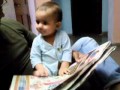 Nine Month Old Indian Kupari Girl Reading A Newspaper