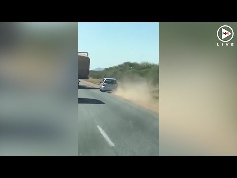 Car fails to overtake truck, flies through bushes
