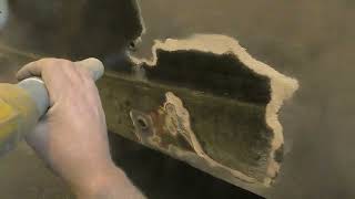 Removing layers of paint rust and filler off this boat ready for new coatings